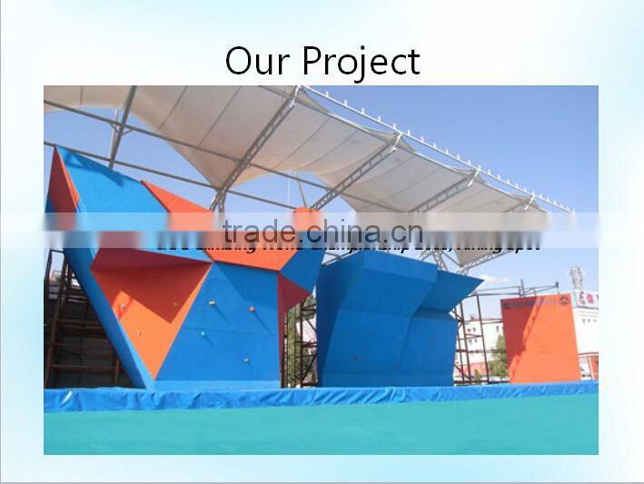 Economic composite wood rock climbing panel for climbing walls