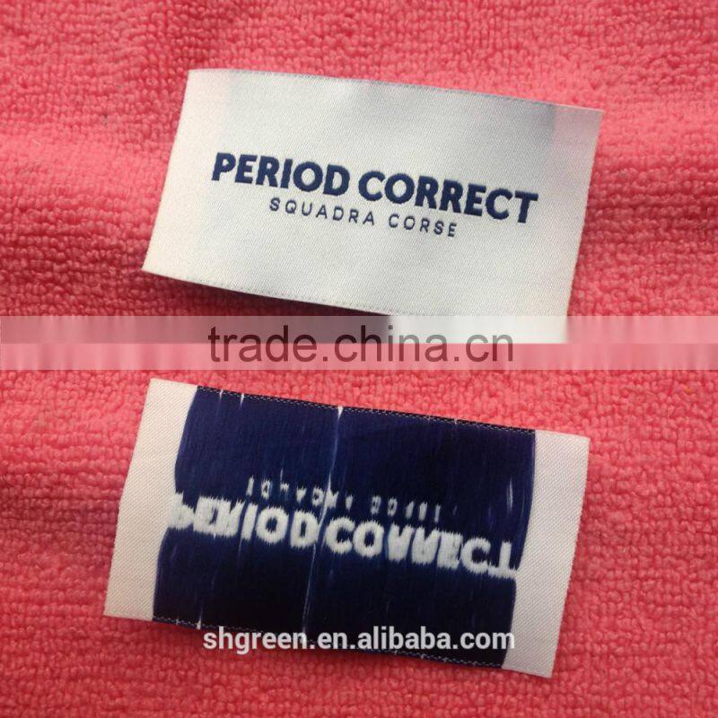 soft white satin woven label with silver metallic logo