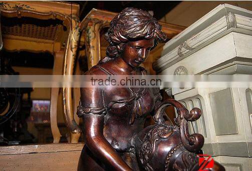 Bronze lady statue with shell water fountain