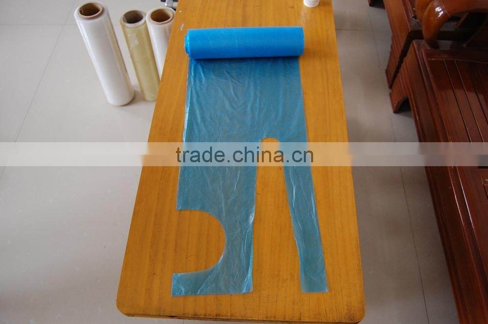 white disposable plastic apron
