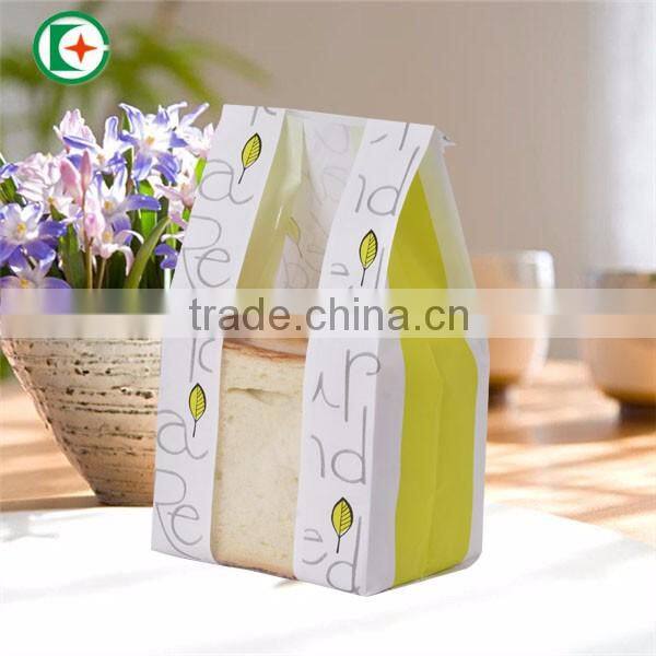 Paper bag with plastic window which be used to take bread and hamburger