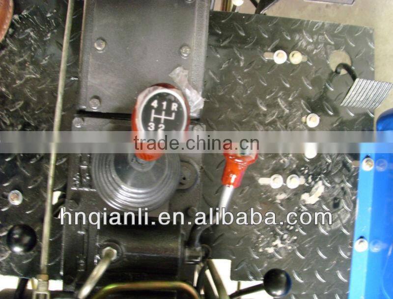 small farm tractor with trailer and front end loader