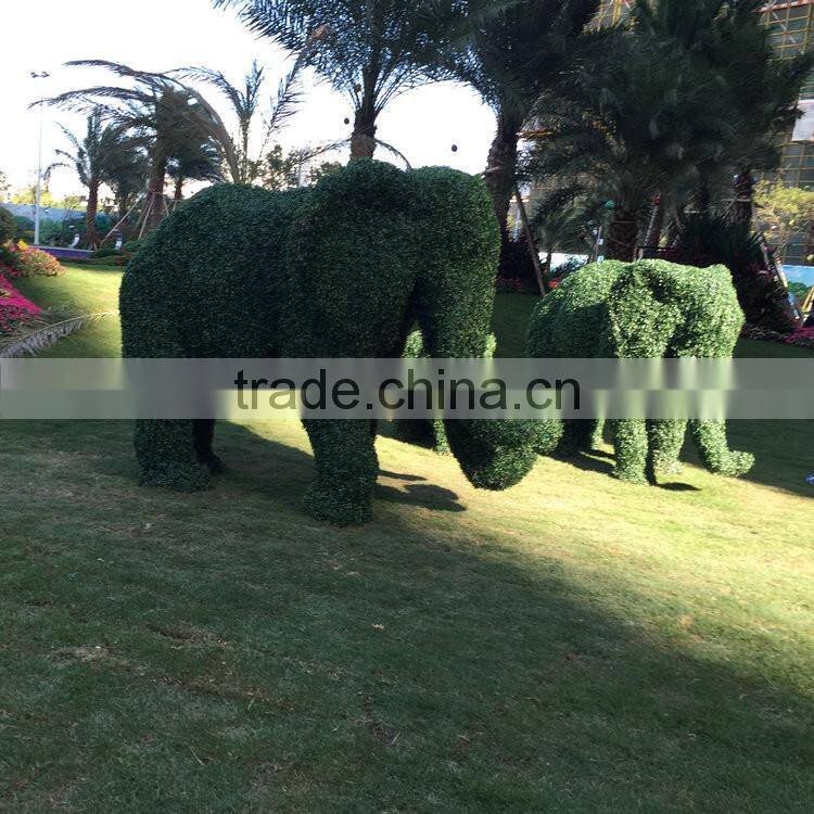 Fiberglass elephant sculpture with artificial grass