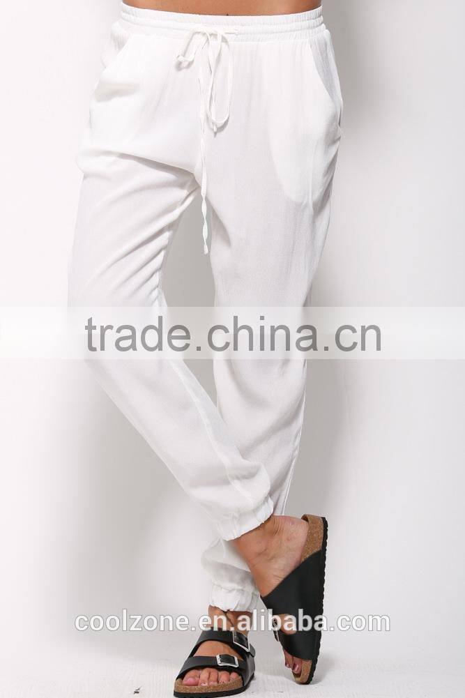 Loose fit elastic tied waist jogger pants with side pockets