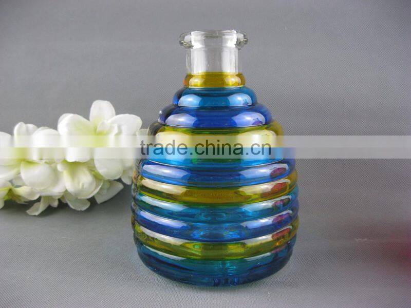 Hanging glass bee catcher with metal handle and wood cork stopper for home and garden use