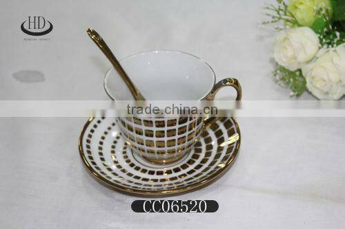 gold rim ceramic coffee cup and saucer