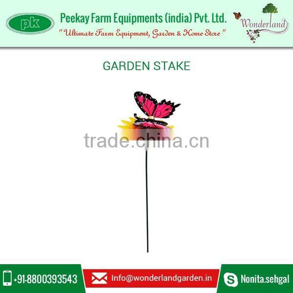 Metal Flowers and Garden Stakes with Decorative Metal Garden Butterfly Sitting