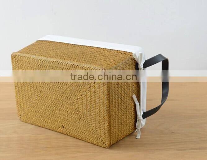 basket made of natural straw seagrass for housewaring with handle and lining