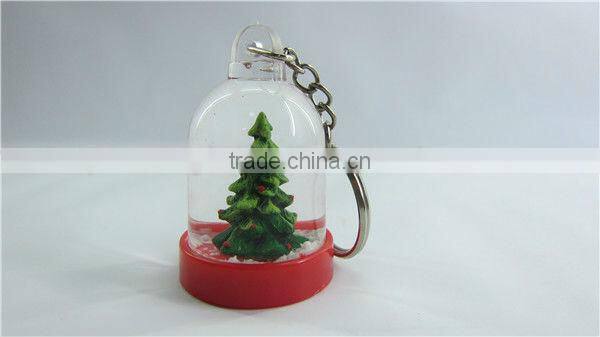 Plastic snow globe penguin key chain