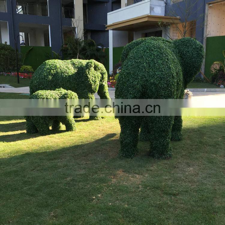 Fiberglass elephant sculpture with artificial grass