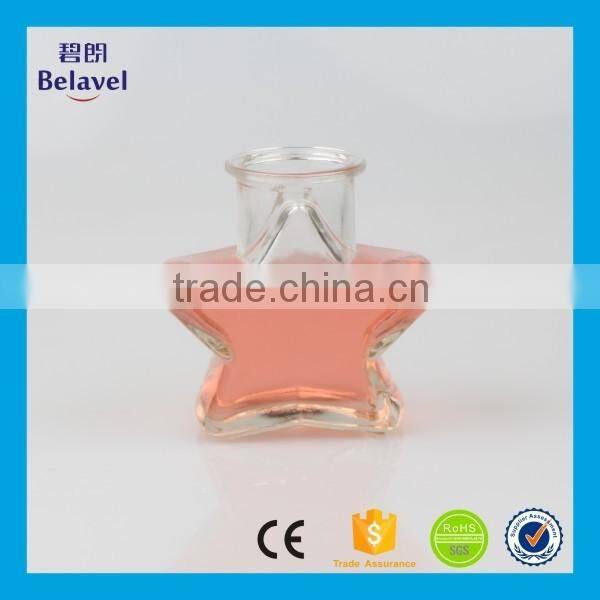 Hot sale star shape wedding decoration clear glass mini bottle