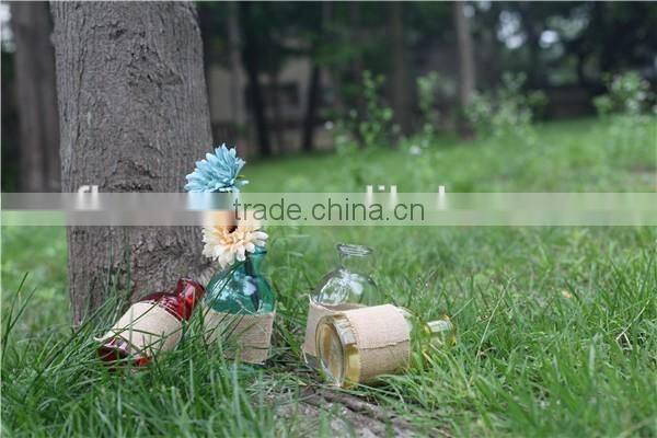 wholesale cheap small round colored glass vase for flower with linen