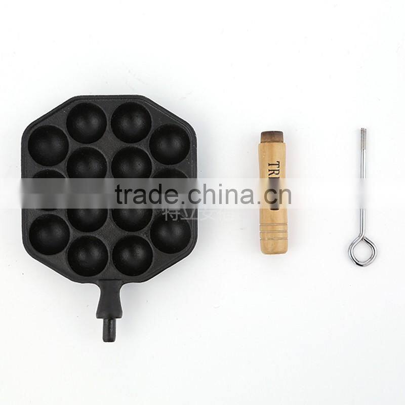 Mini cast iron takoyaki grill with wooden handle