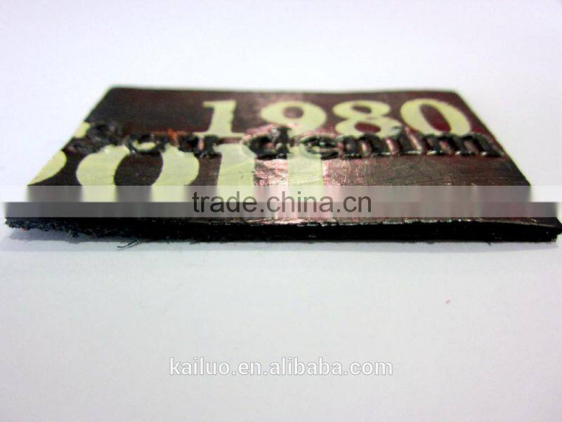 Embossed logo leather label for jeans
