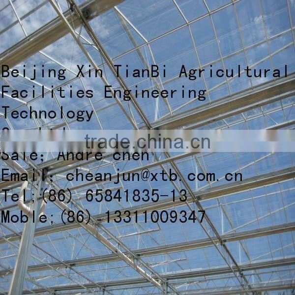 Single layer plastic film multi-span greenhouse