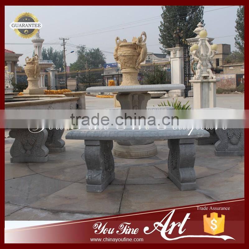 outdoor round stone dining table