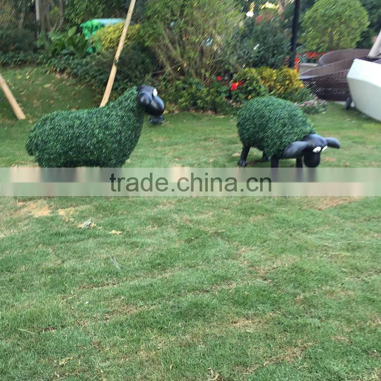 Fiberglass goat statue with artificial grass