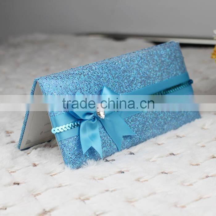 Hot sale attractive golden hardcover folded wedding invitations with paillette ribbons bowkont & crystal decoration