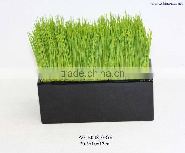 artificial grass in white ceramic pot