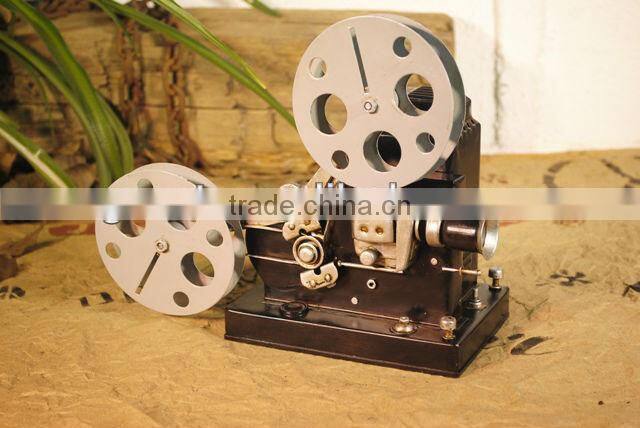 Antique metal movie camera model with paint