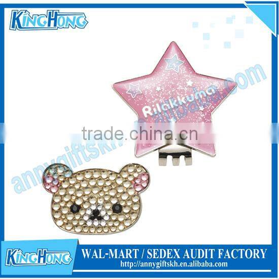 Ladies golfer ball marker with cap clip