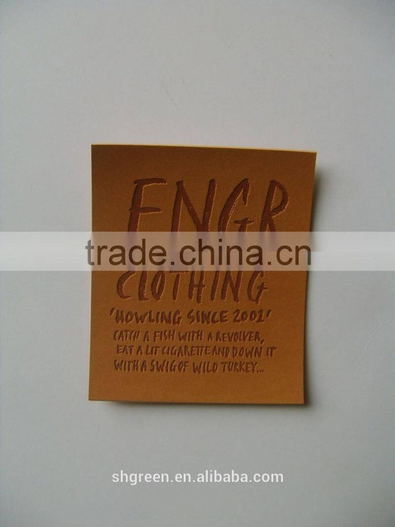 Soft debossed company name leather tags for suits