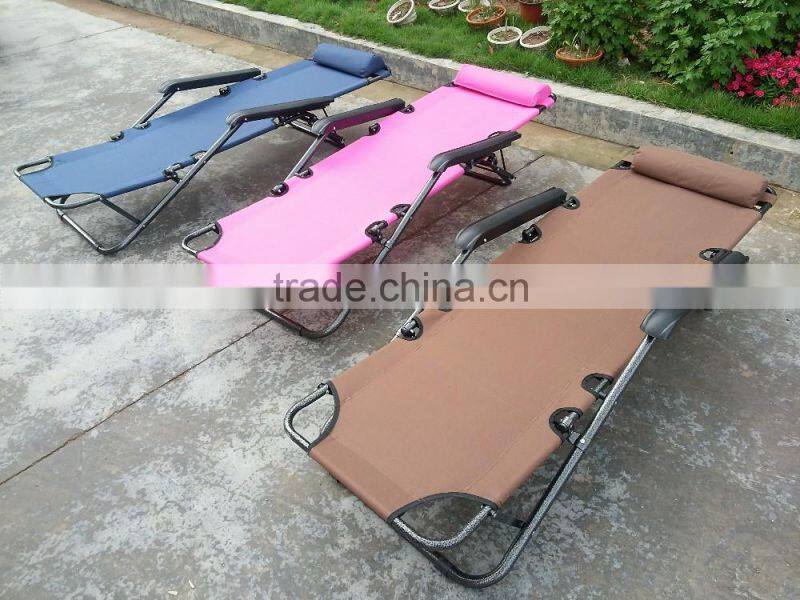 Folding lounge with foot rest and pillow