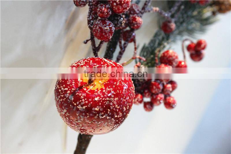 pine tree red fruit branch winter festival decorationwith snowy effect