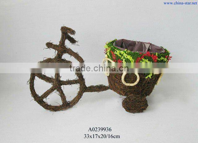 rattan bicycle planter with broomcorn decoration