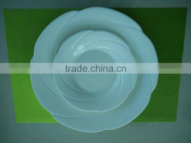small white porcelain plates with cut edge shape