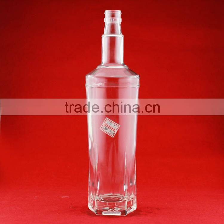 Hot selling cheap embossed spirit bottles glass vodka bottles 700ml french brandy bottle with cork