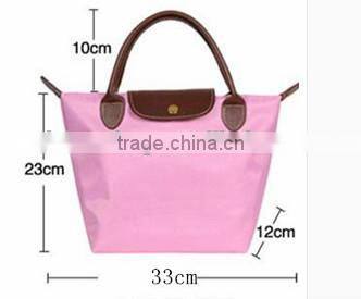 Foldable nylon shopping bag with zipper and button closure