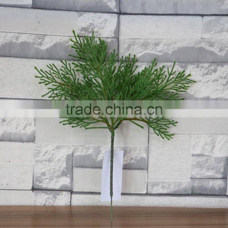 Plastic green cypress branch