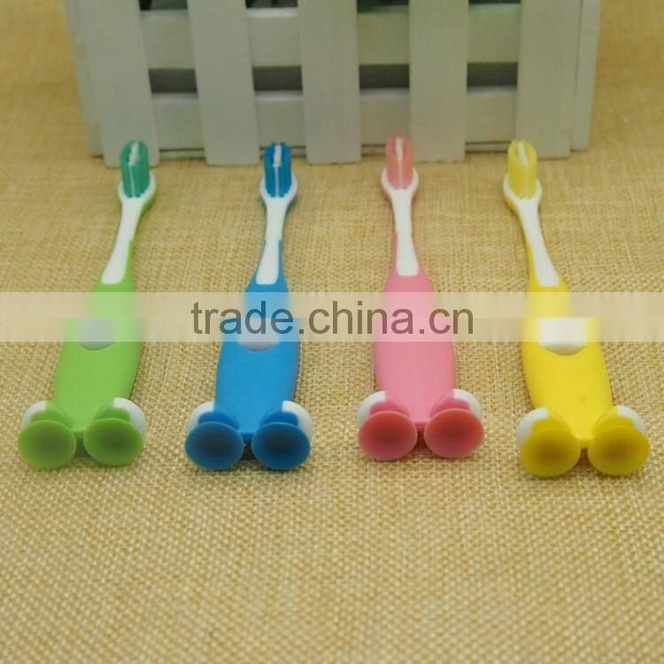 smile style handle toothbrush for kids soft rubber sucker bottom children toothbrush with tongue cleaner