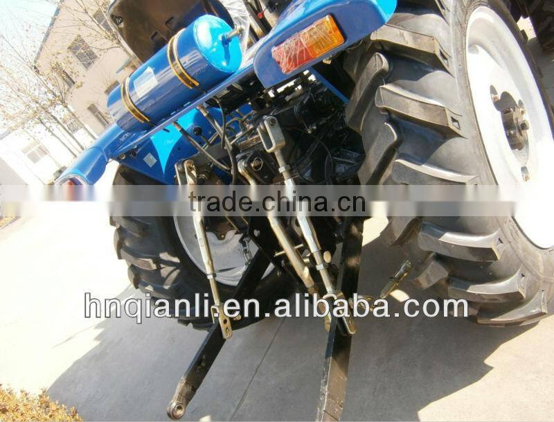 small farm tractor with trailer and front end loader