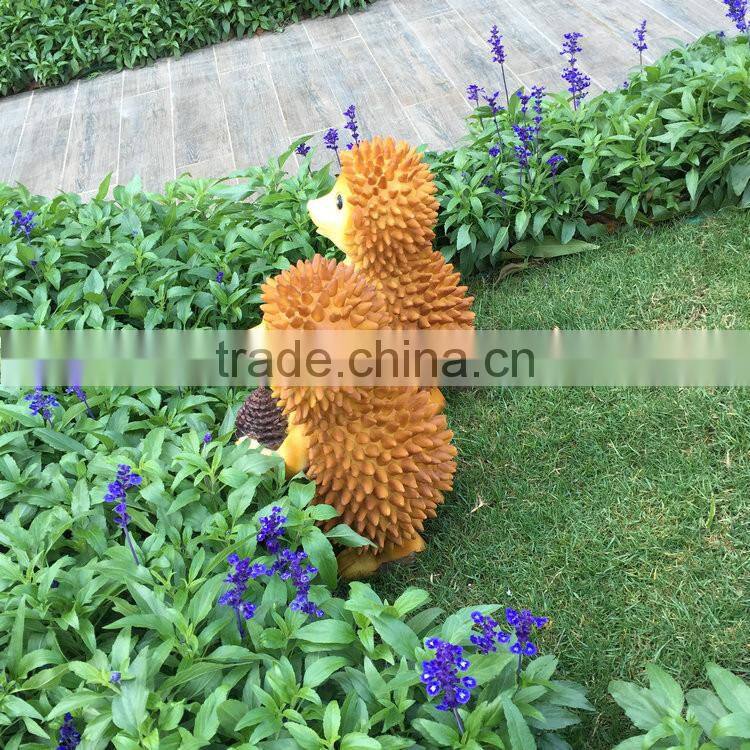 Polyresin squirrel figure in garden