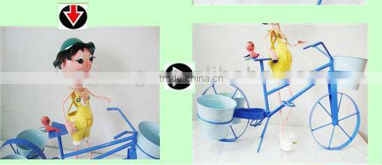 Metal Doll With Flower Pots