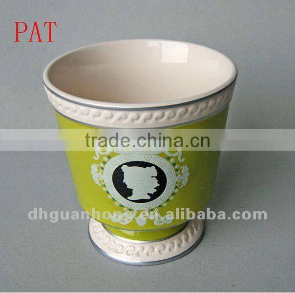 Stock ceramic flower pot in pink color round shape