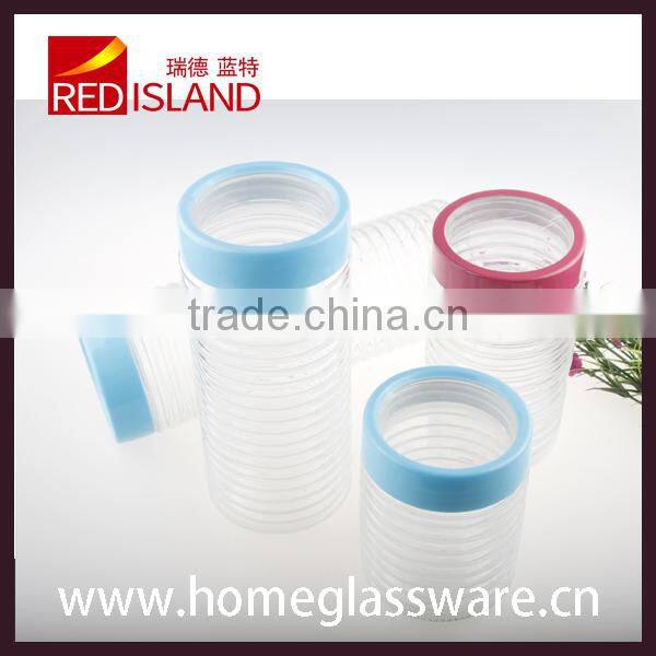 cylindrical food storage glass jar with plastic lid