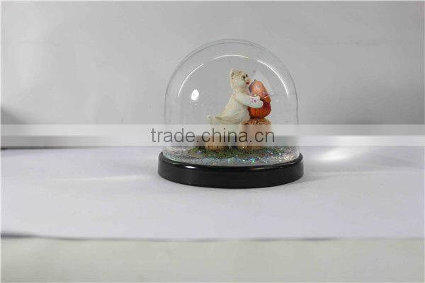Plastic pumpkin halloween snow globe