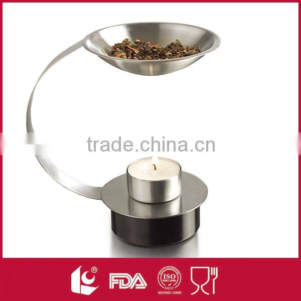 Four slender silver metal stylishly aromatherapy oil burners