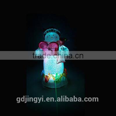 Holding a red heart acrylic snowman with LED Light