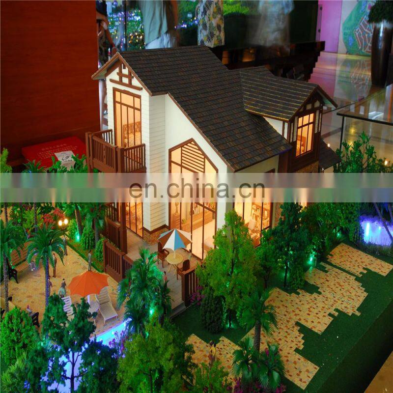 Small house model with warm light effect, architectural maquette