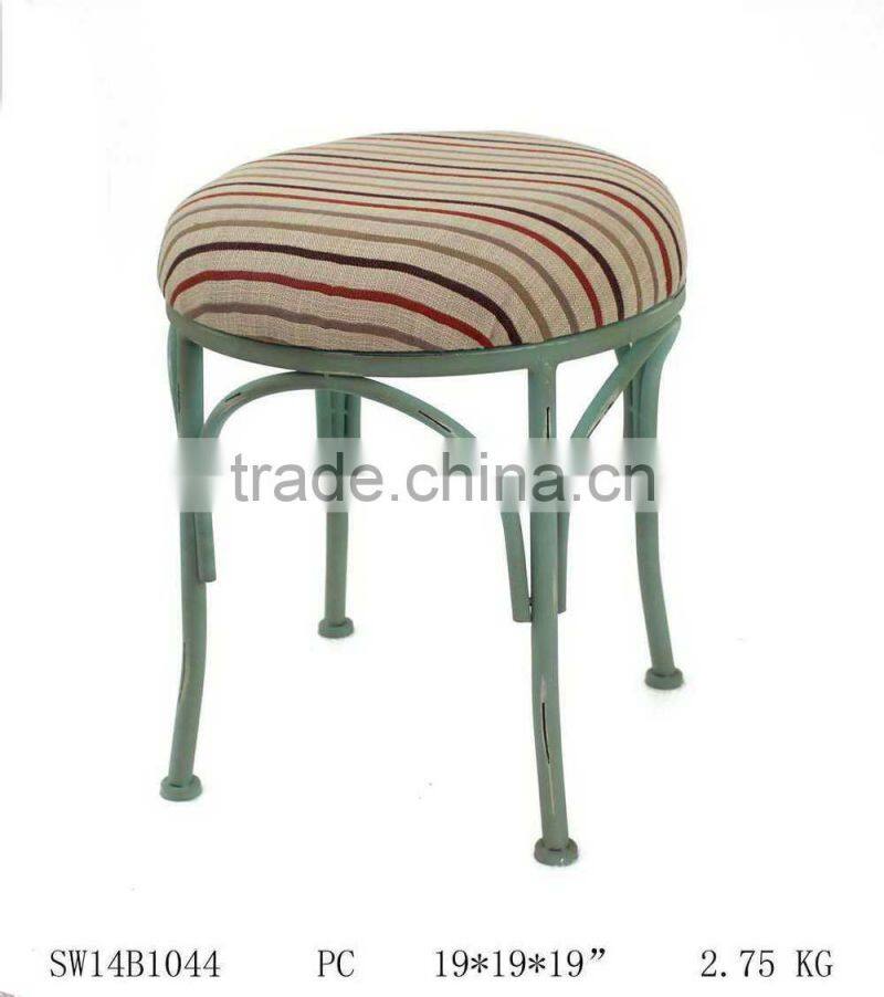 tubular metal chair with linen cushion