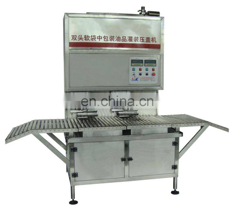 Fruit juice bag in box filling and sealing machine