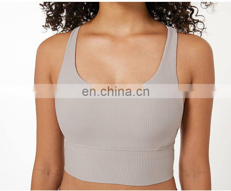 Custom new 75% nylon 25% spandex thread fabric ladies gym wear strappy sports bra top fitness bra for women