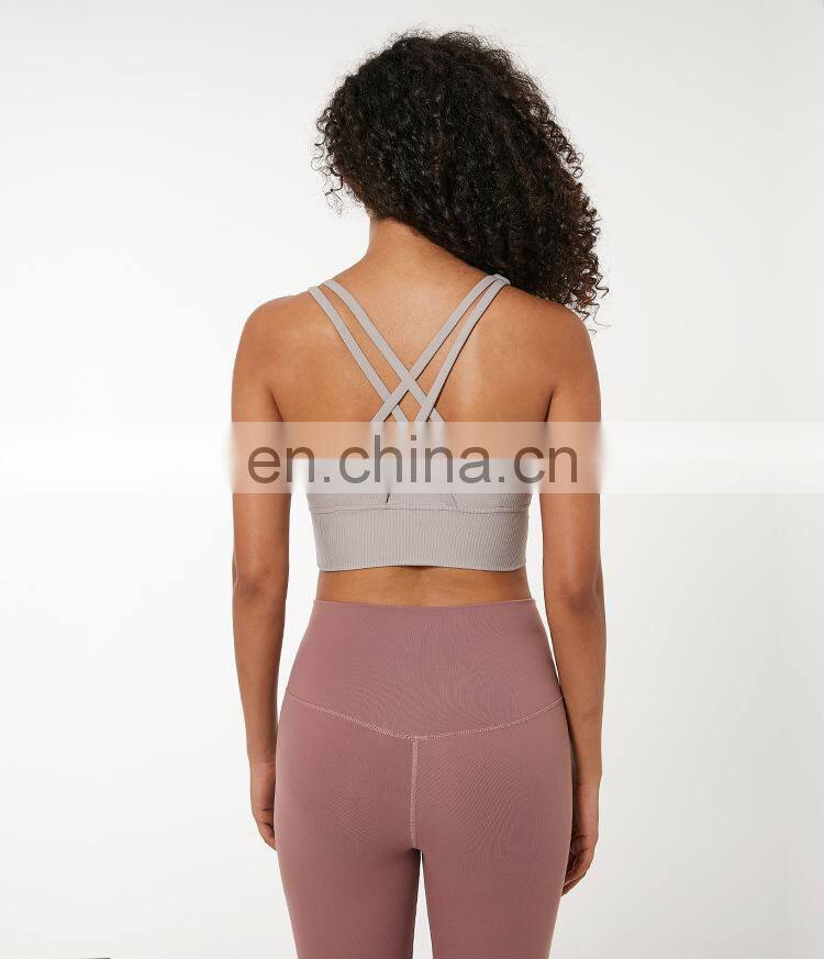 Custom new 75% nylon 25% spandex thread fabric ladies gym wear strappy sports bra top fitness bra for women