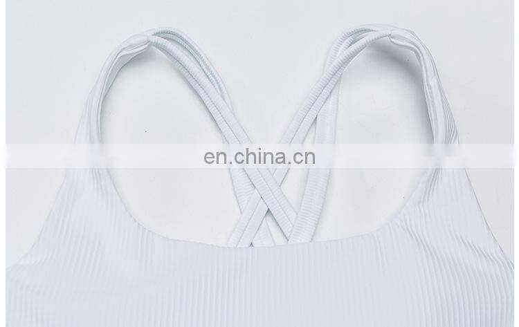 Custom new 75% nylon 25% spandex thread fabric ladies gym wear strappy sports bra top fitness bra for women