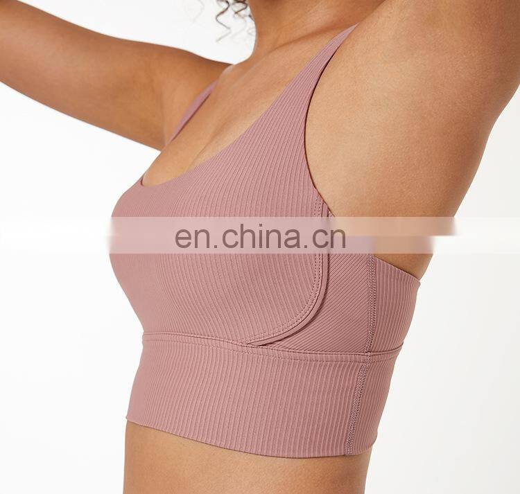 Custom new 75% nylon 25% spandex thread fabric ladies gym wear strappy sports bra top fitness bra for women