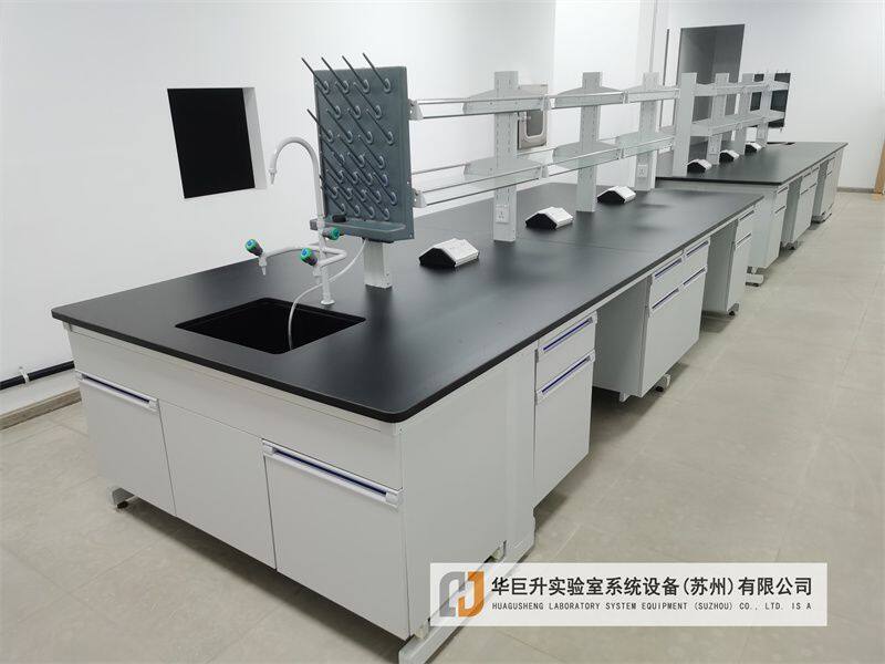 How to calculate the number of fume hoods and workbench area required for a laboratory?